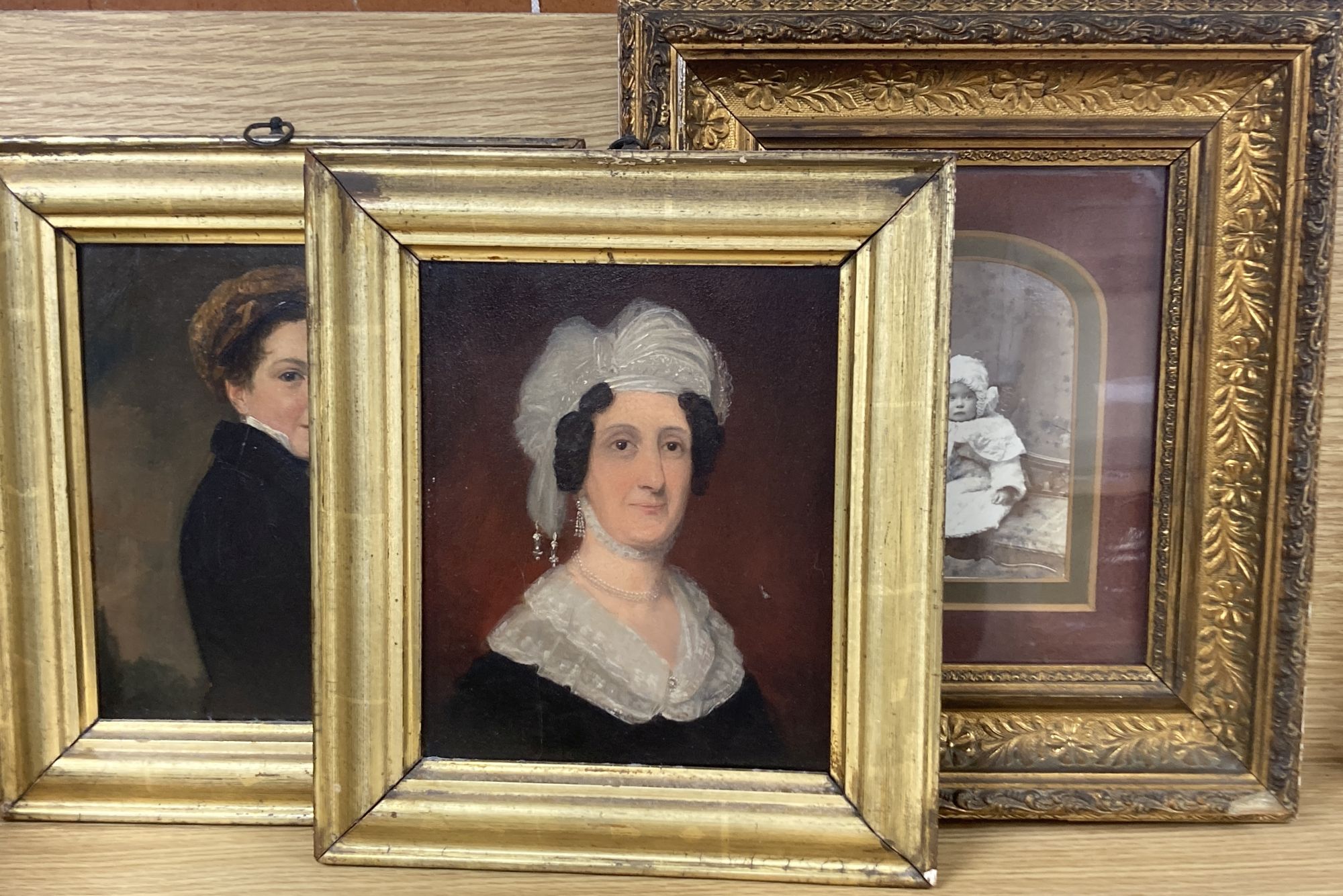Early 19th century English School, two oils on artists board, Portrait of a lady wearing a lace hat and of a youth, 20 x 16.5cm